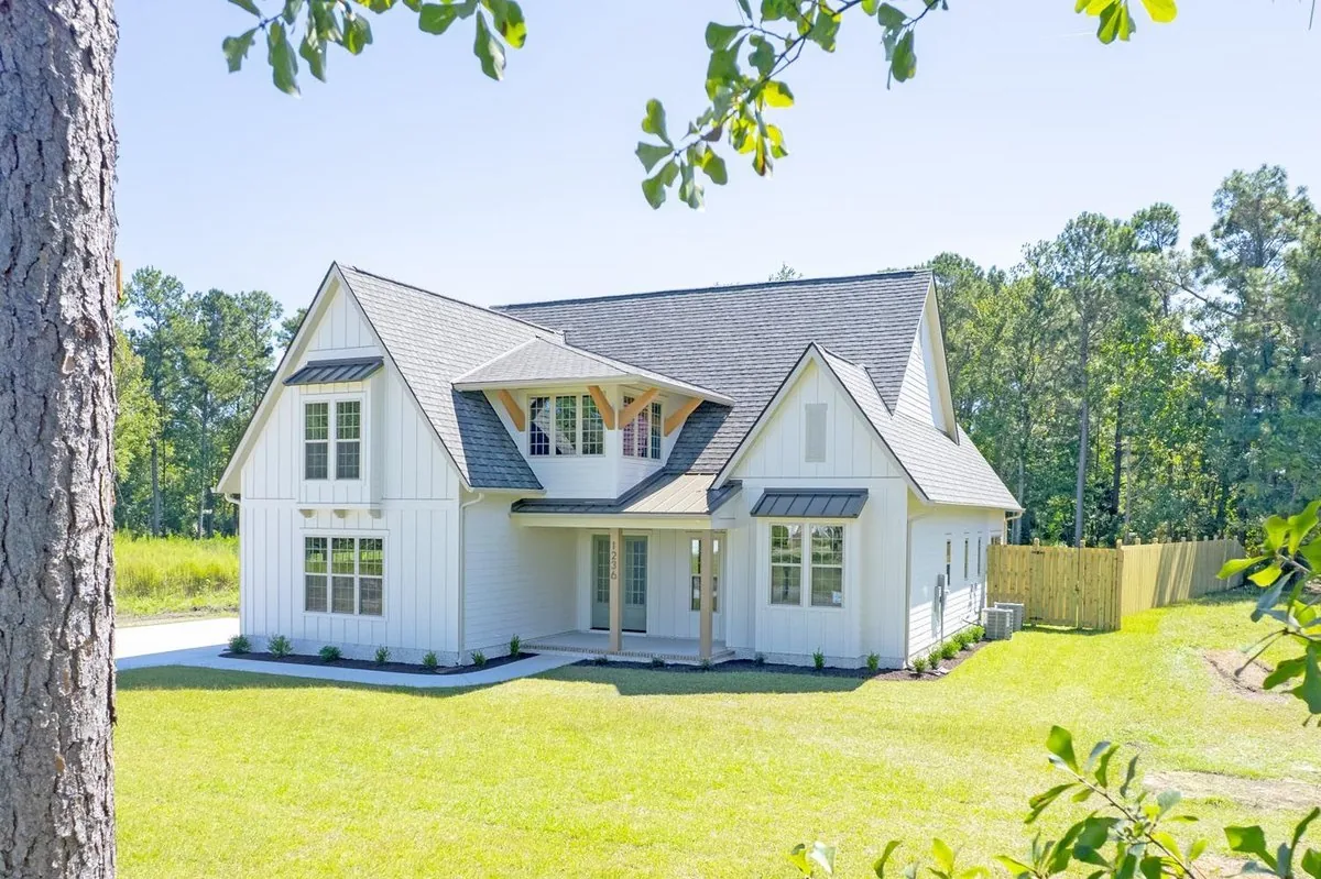 New two story home with board and batten siding and a covered entry porch