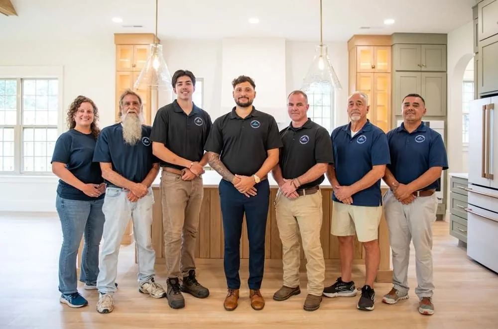 The Delaney's Coastal Construction team together in a finished kitchen